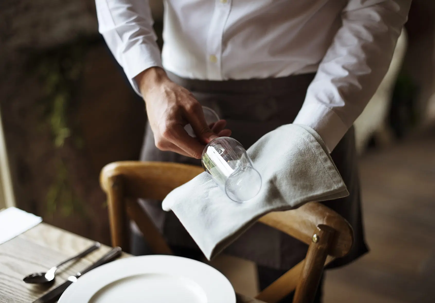 Restaurant Staff Setting Table in Restaurant for Reception