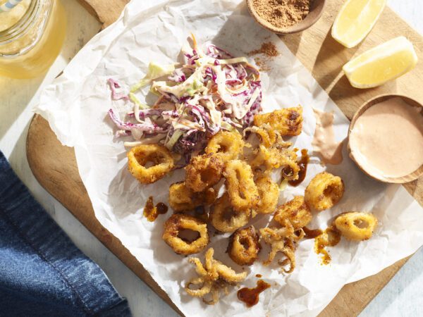 Nashville Hot Calamari with coleslaw on wooden board