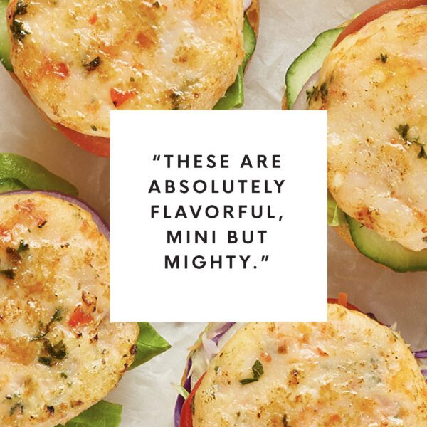 Overhead view of shrimp sliders with white box text overlay that reads "These are absolutely flavorful, mini but mighty."