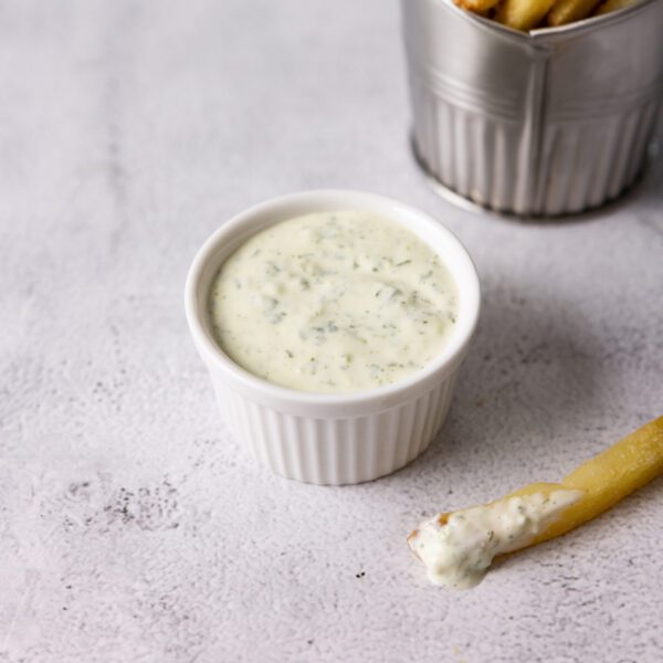 Jalapeno Aioli in a white ceramic bowl with a side of french fries